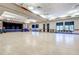 Spacious meeting hall with stage, hardwood floors and ample seating at 13992 E Marina Dr # 109, Aurora, CO 80014