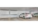 Well-lit parking garage featuring designated parking spaces and secure storage units at 13992 E Marina Dr # 109, Aurora, CO 80014