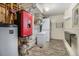 Organized basement with washer and dryer, utility sink, and finished flooring at 31084 Kings Valley Dr, Conifer, CO 80433