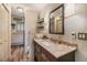 Charming bathroom features granite countertops, wooden cabinets and stylish fixtures at 31084 Kings Valley Dr, Conifer, CO 80433