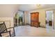 Bright bedroom with walk-out deck and large armoire, offering ample space and natural light at 31084 Kings Valley Dr, Conifer, CO 80433