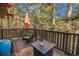 Relaxing deck featuring outdoor seating and scenic views of surrounding trees at 31084 Kings Valley Dr, Conifer, CO 80433