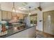 Well-appointed kitchen featuring granite countertops, modern appliances, and a stylish backsplash at 31084 Kings Valley Dr, Conifer, CO 80433