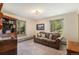 Cozy living room filled with natural light and featuring a comfortable sofa at 31084 Kings Valley Dr, Conifer, CO 80433