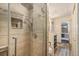 Modern shower features tile surround, glass enclosure, and luxurious shower head at 31084 Kings Valley Dr, Conifer, CO 80433