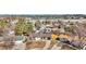Aerial view of a single-story home with a brown roof in a neighborhood with mature trees at 436 Pluto Ct, Lone Tree, CO 80124