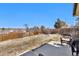 Fenced backyard with grass, trees, and patio with seating area at 436 Pluto Ct, Lone Tree, CO 80124