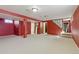 Finished basement with carpet flooring featuring multiple access points and a bright color scheme at 436 Pluto Ct, Lone Tree, CO 80124
