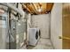 Basement laundry area with newer washer and dryer plus furnace and water heater at 436 Pluto Ct, Lone Tree, CO 80124