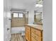 Well-lit bathroom featuring a vanity, tub/shower combo, and modern fixtures at 436 Pluto Ct, Lone Tree, CO 80124