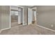 Carpeted bedroom featuring a mirrored closet door and neutral-toned walls at 436 Pluto Ct, Lone Tree, CO 80124