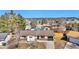 Charming single-story home featuring a brick facade, attached garage, and mature trees in a suburban neighborhood at 436 Pluto Ct, Lone Tree, CO 80124