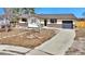 Exterior showcasing a single-story home with an attached garage and spacious front yard at 436 Pluto Ct, Lone Tree, CO 80124