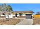 Charming home with a well-kept exterior, tidy landscaping, and a driveway leading to an attached garage at 436 Pluto Ct, Lone Tree, CO 80124