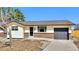 Inviting single-story home with a brick and siding exterior, well-maintained lawn, and an attached garage at 436 Pluto Ct, Lone Tree, CO 80124