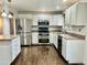 Updated kitchen featuring stainless steel appliances, modern cabinets and hardwood flooring at 436 Pluto Ct, Lone Tree, CO 80124