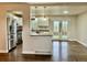 Bright kitchen featuring white cabinets, stainless steel appliances and access to a sun-filled patio at 436 Pluto Ct, Lone Tree, CO 80124