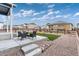Enjoy the fenced backyard with patio, artificial grass, and play area, perfect for outdoor activities at 2186 Prairie Smoke Dr, Monument, CO 80132