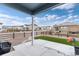Backyard featuring synthetic grass, an outdoor patio, and a fenced perimeter at 2186 Prairie Smoke Dr, Monument, CO 80132