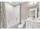 Bathroom featuring a bathtub with shower, white cabinets and vanity, and tile floors at 2186 Prairie Smoke Dr, Monument, CO 80132