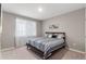 Cozy bedroom with natural light, features neutral walls and carpeted floors, and comfortable bedding at 2186 Prairie Smoke Dr, Monument, CO 80132