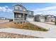Charming two-story home featuring a covered porch, attached two car garage and mature landscaping at 2186 Prairie Smoke Dr, Monument, CO 80132