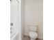 Clean bathroom featuring a shower and toilet in a bright room at 759 N Deer Park St, Watkins, CO 80137