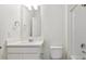 Clean bathroom featuring a sink, toilet, and bathtub with shower at 759 N Deer Park St, Watkins, CO 80137