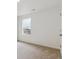 Bedroom with neutral carpet and large window letting in natural light at 759 N Deer Park St, Watkins, CO 80137