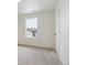 Carpeted bedroom with a window overlooking the neighborhood at 759 N Deer Park St, Watkins, CO 80137