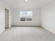 Bright bedroom featuring plush carpeting and a window view at 759 N Deer Park St, Watkins, CO 80137