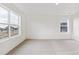 Carpeted bedroom with ample light from multiple windows at 759 N Deer Park St, Watkins, CO 80137