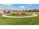 Community park showcasing landscaping, walking path and playground bordered by newer single-Gathering homes at 759 N Deer Park St, Watkins, CO 80137