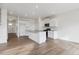 Modern kitchen featuring white cabinets, stainless steel appliances, and a functional island with ample counter space at 759 N Deer Park St, Watkins, CO 80137