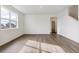 Bright living room with large window, hardwood floors and natural light at 759 N Deer Park St, Watkins, CO 80137