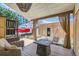 Relaxing backyard patio with comfortable seating, fire pit, and charming outdoor decor at 1559 Elm St, Denver, CO 80220