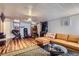 Finished basement featuring laminate floors, home gym, and entertainment area at 1559 Elm St, Denver, CO 80220