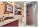 Bathroom with updated shower and neutral finishes, offering a clean and functional space at 1559 Elm St, Denver, CO 80220
