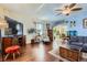Elegant and spacious living room with hardwood floors, featuring modern media setup and comfortable seating arrangement at 1559 Elm St, Denver, CO 80220