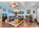 Spacious living room with wood floors, a stylish bar area, aquarium, and plenty of natural light, perfect for relaxing or entertaining at 1559 Elm St, Denver, CO 80220