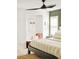 Inviting bedroom with a ceiling fan, neutral decor, and a cozy reading nook at 150 S Harrison St # 106, Denver, CO 80209