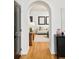 Stylish entryway with hardwood floors and an arched doorway at 150 S Harrison St # 106, Denver, CO 80209