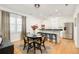 Bright kitchen and dining area with stainless steel appliances and hardwood floors at 150 S Harrison St # 106, Denver, CO 80209