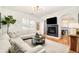Cozy living room with fireplace and hardwood floors, perfect for relaxing at 150 S Harrison St # 106, Denver, CO 80209