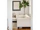 Comfortable living room featuring stylish neutral furniture and natural light at 150 S Harrison St # 106, Denver, CO 80209