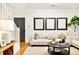 Comfortable living room with soft lighting and neutral tones at 150 S Harrison St # 106, Denver, CO 80209
