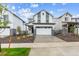 Charming home featuring a two-car garage, neutral paint scheme, and low maintenance landscaped front yard at 19039 E 94Th Pl, Commerce City, CO 80022
