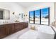 Spa-like bathroom with soaking tub, double vanity, and large window at 2442 Fox View Trl, Franktown, CO 80116