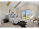 Bedroom featuring vaulted ceilings, carpet floors, and a large window at 2442 Fox View Trl, Franktown, CO 80116