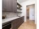 Butler's pantry with quartz countertops and ample storage space at 2442 Fox View Trl, Franktown, CO 80116